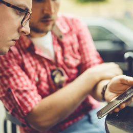 Two men share photos, video on a Samsung phone