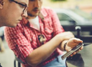 Two men share photos, video on a Samsung phone