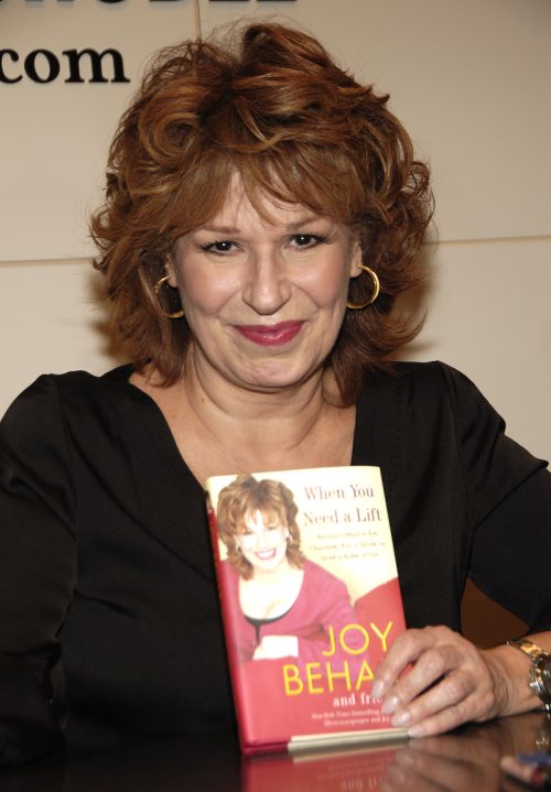 Joy Behar posing with her book "When You Need a Life"