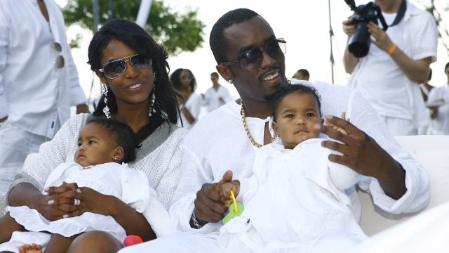 Kim Porter, Diddy, and their twin daughters at his white party in the Hamptons in September 2007