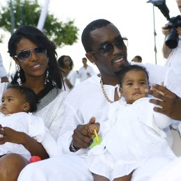 Kim Porter, Diddy, and their twin daughters at his white party in the Hamptons in September 2007