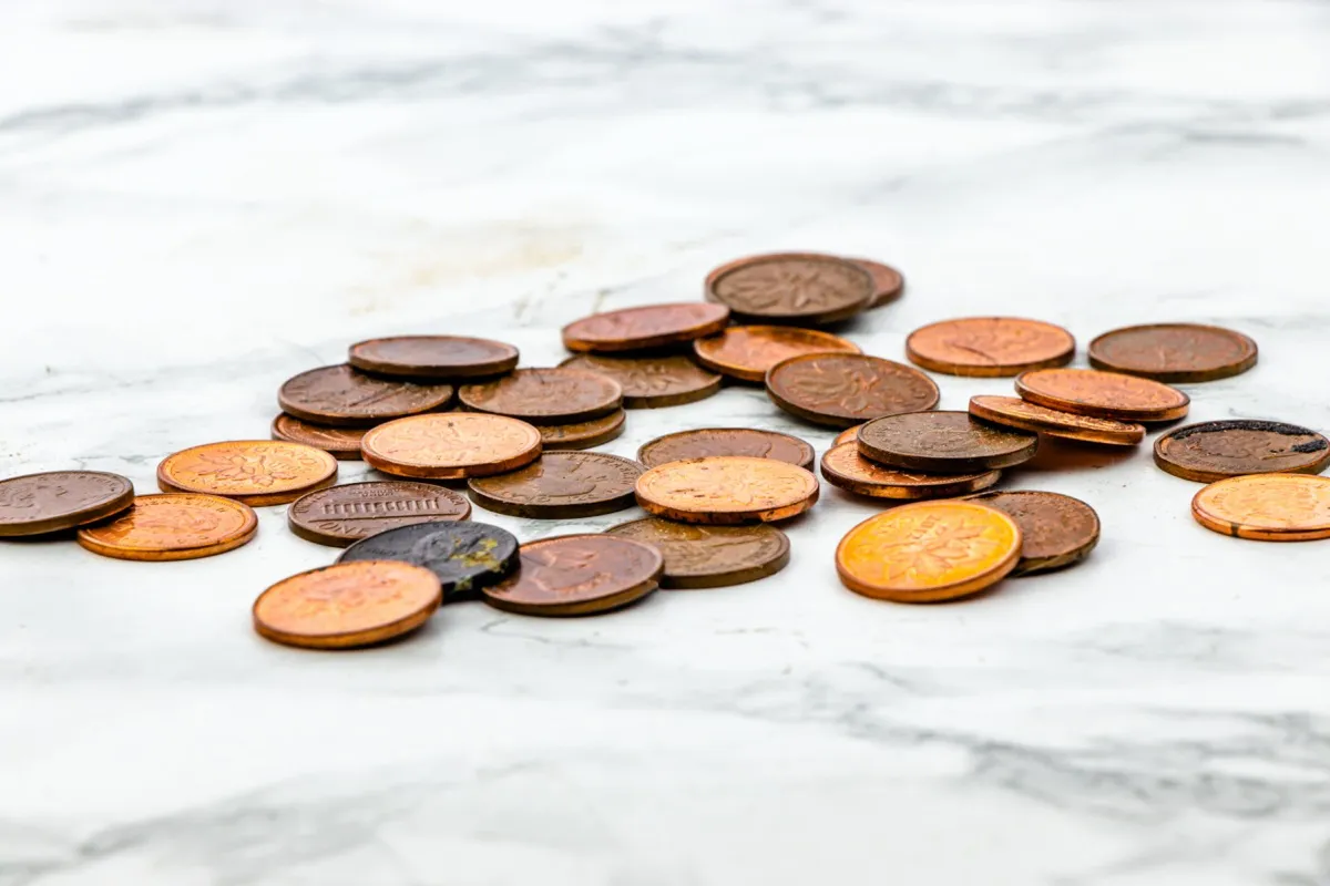 Pennies on marble counter