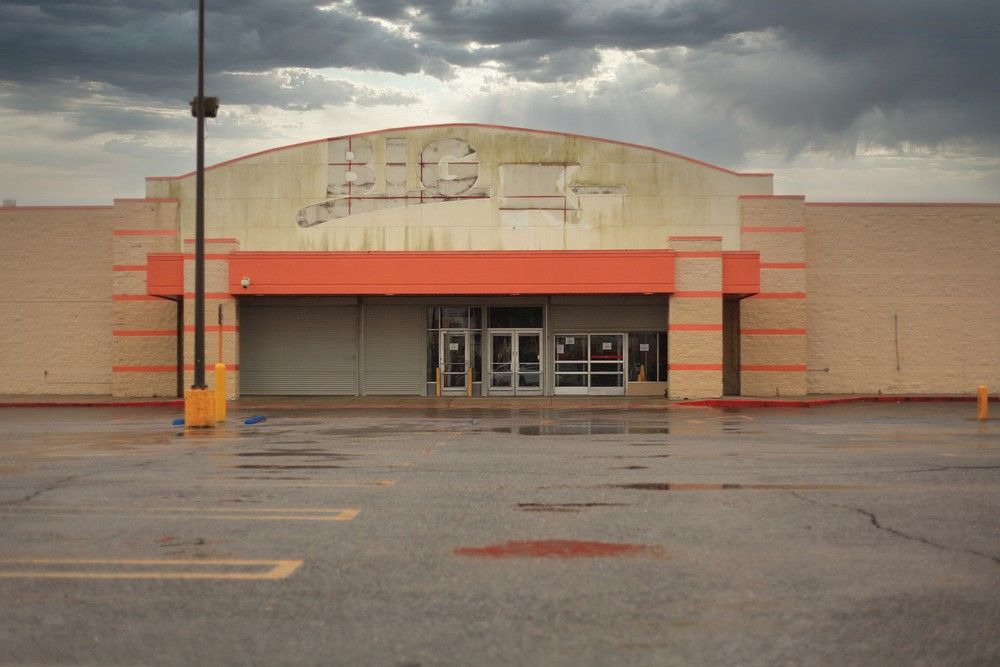 A closed Kmart location with the signage removed