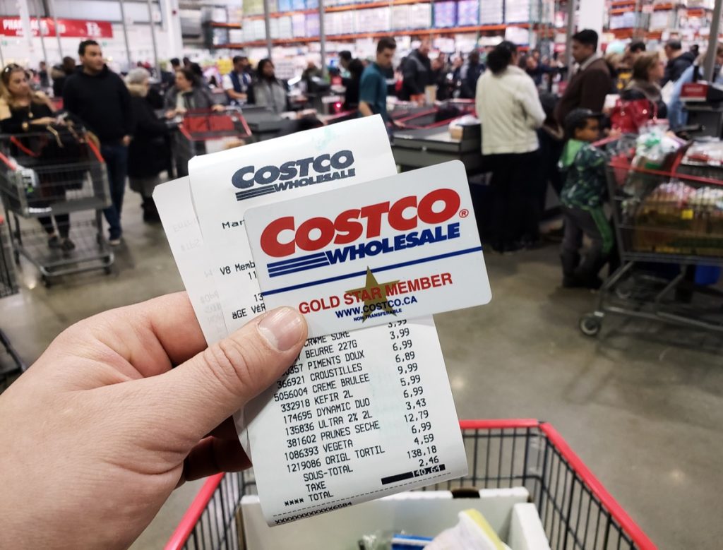 hand holding costco card and receipt