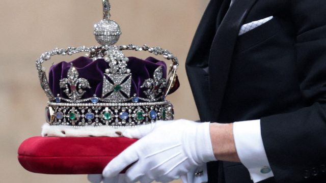 The Imperial State Crown arrives for the State Opening of Parliament at the Houses of Parliament in London on May 11, 2021, which is taking place with a reduced capacity due to Covid-19 restrictions. - The State Opening of Parliament is where Queen Elizabeth II performs her ceremonial duty of informing parliament about the government's agenda for the coming year in a Queen's Speech.