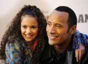 Dwayne Johnson, aka "The Rock" and Madison Pettis pose for photographers at a photo call for the film "The Game Plan" in Berlin on March 5, 2008.