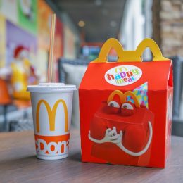 BANGKOK - OCTOBER 10 : Happy meal set ,in soft focus, with blurred Ronald Mcdonald at McDonald's restaurant on October 10, 2017 in Bangkok, Thailand