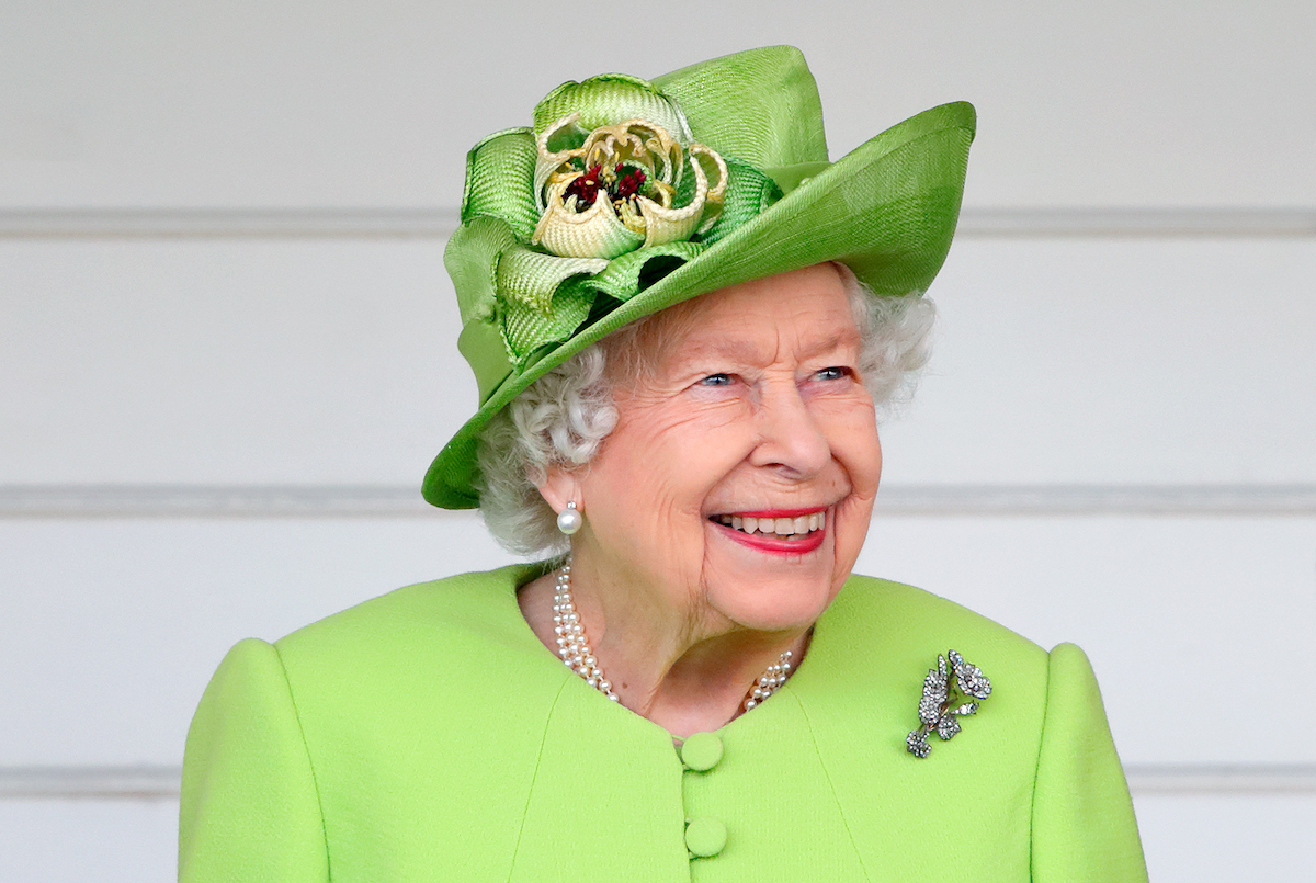 Queen Elizabeth II (wearing her Vanguard Rose Brooch which she received in 1944 from Messrs John Brown and Co. when she launched HMS Vanguard) attends the Out-Sourcing Inc. Royal Windsor Cup polo match and a carriage driving display by the British Driving Society at Guards Polo Club, Smith's Lawn on July 11, 2021 in Egham, England.