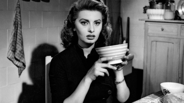 sophia loren holding coffee cup in black and white movie still