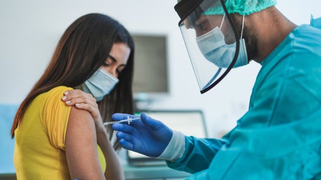 Womann getting a COVID vaccine