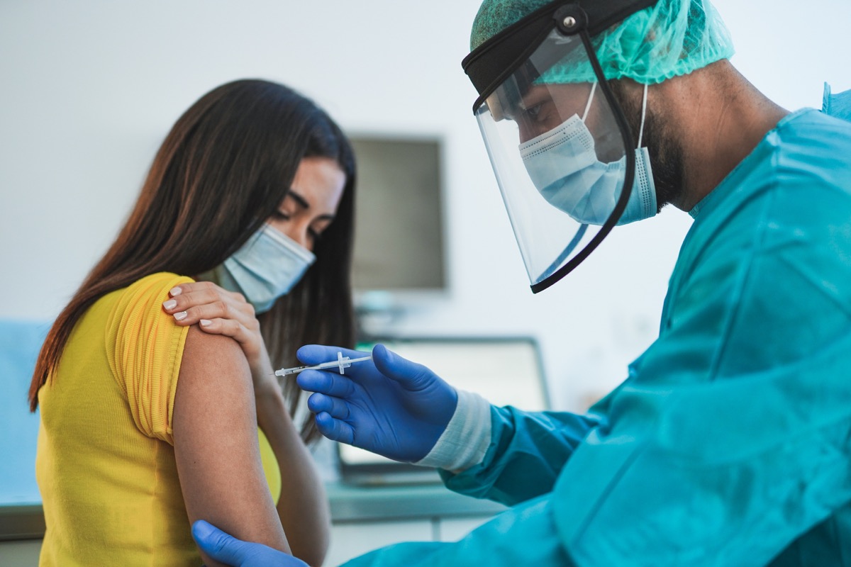 Womann getting a COVID vaccine