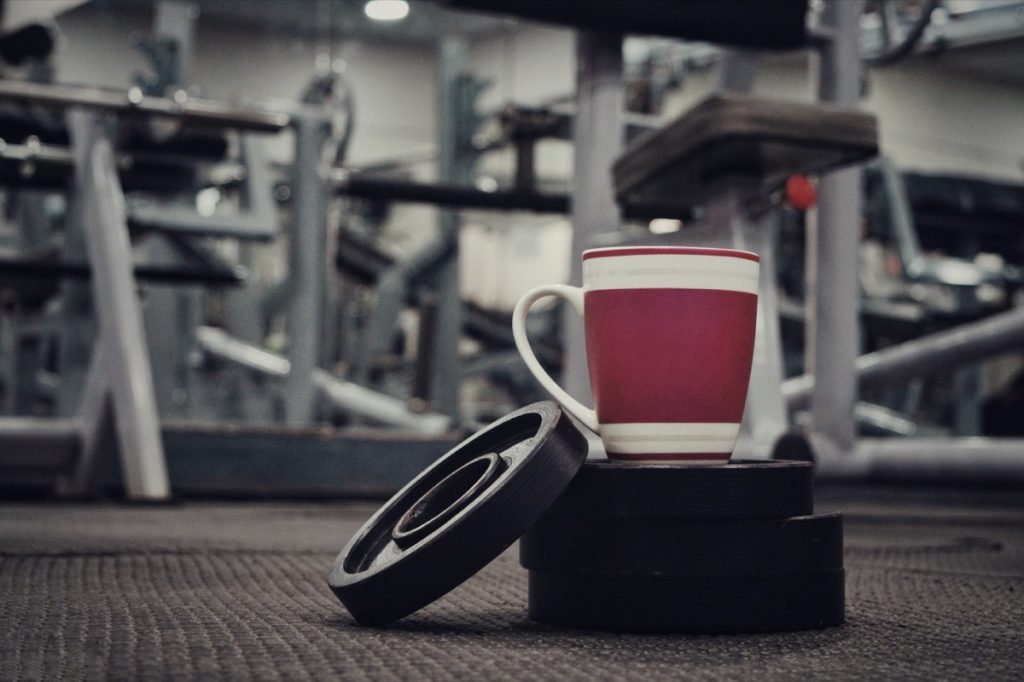 Coffee mug on weights in a gym