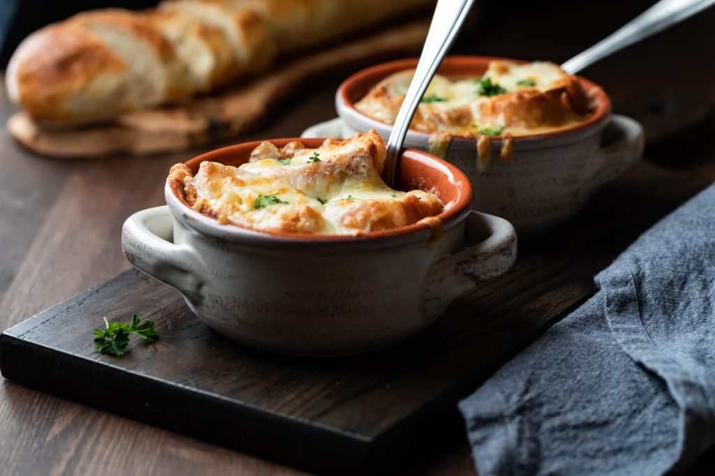 Crocks of french onion soup with melted cheese