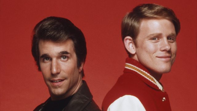 Henry Winkler and Ron Howard posing for a photo in character as Fonzie and Richie from "Happy Days"