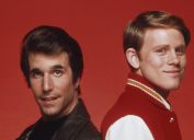 Henry Winkler and Ron Howard posing for a photo in character as Fonzie and Richie from "Happy Days"