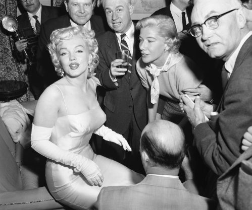 Marilyn Monroe being interviewed by press in 1955