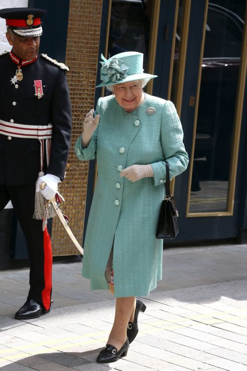 Queen Elizabeth visiting a replica of an original Sainsbury's in May 2019