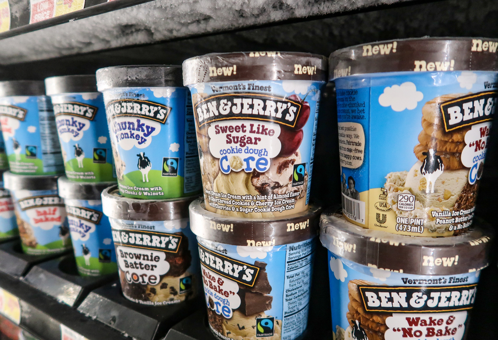 Pints of Ben & Jerry's ice cream in the freezer at the grocery store