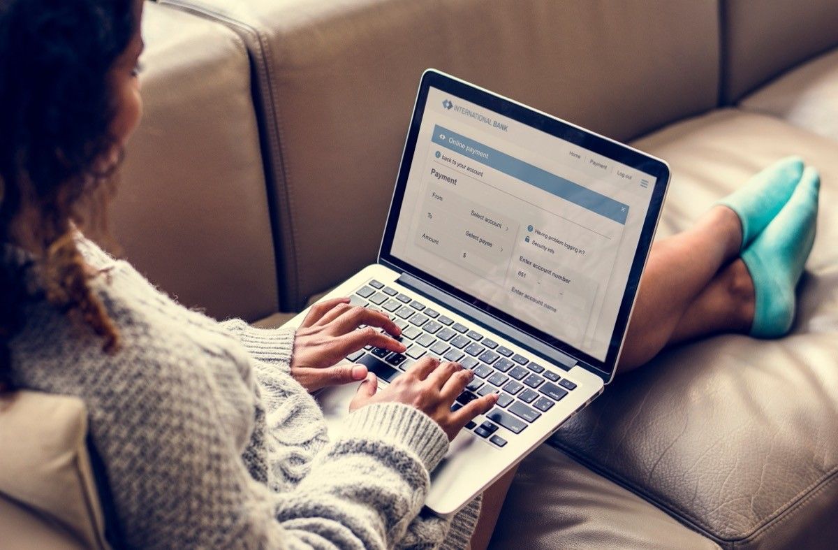 young woman filling out form on computer