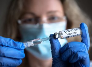 holding covid-19 vaccine