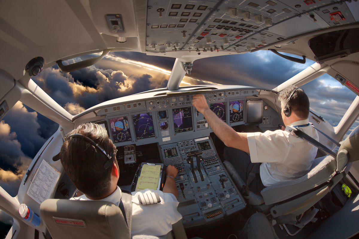 Pilots in the cockpit of an airplane