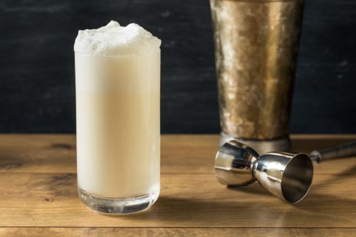 A glass of a Ramos Gin Fizz drink