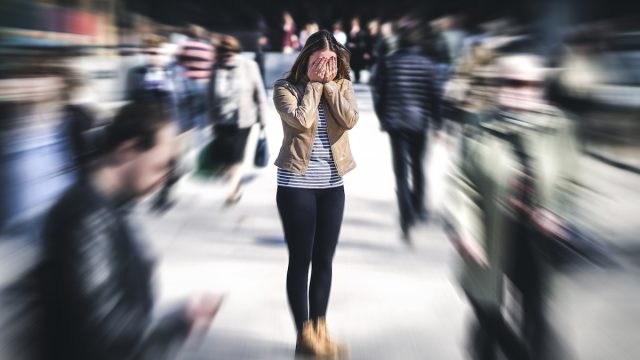 Woman having a panic attack in public