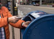Pittsburgh, PA, USA, 2020-01-11: Man sending letter via postal service