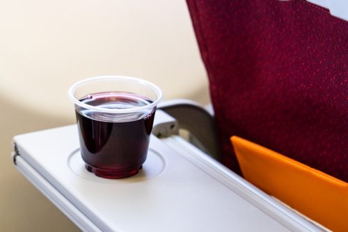 Consume too much red wine or alcohol beverage in-flight causes dehydration when flying