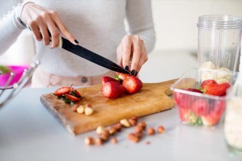 woman cutting strawberries