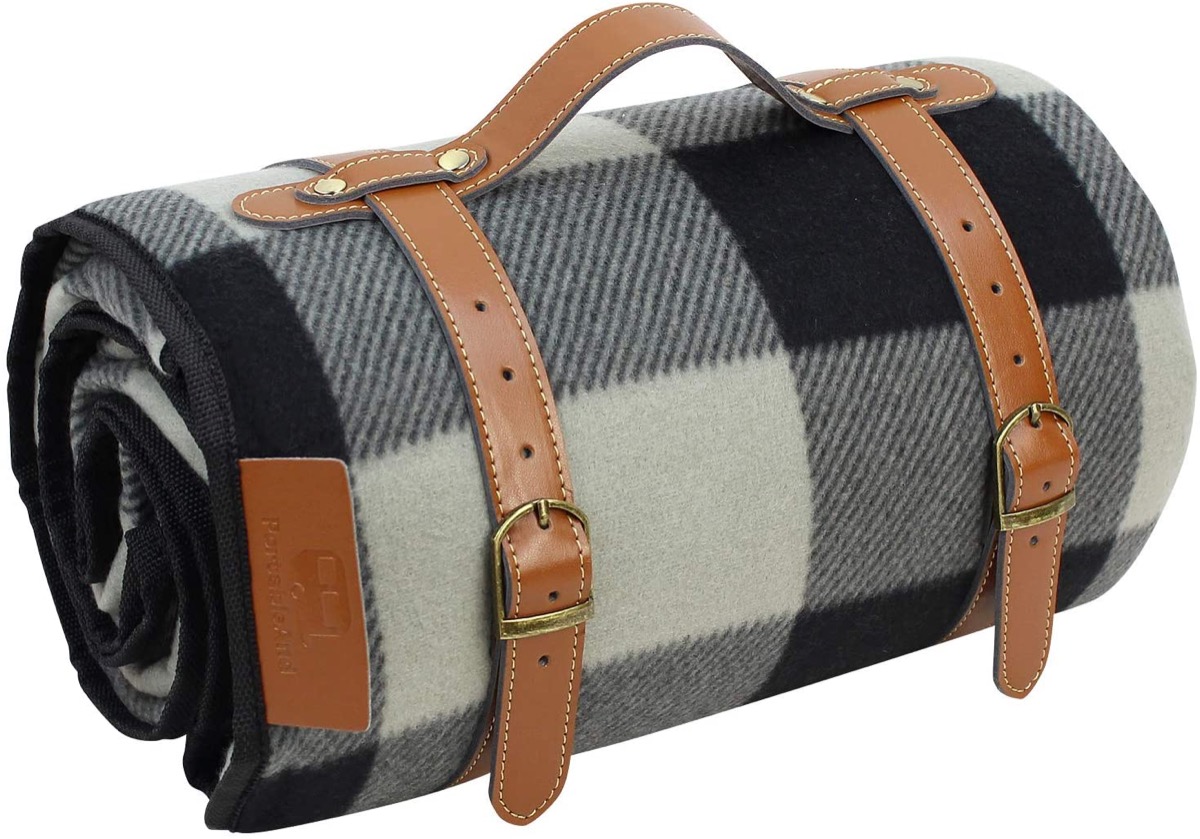 Black and white plaid picnic blanket with leather handle