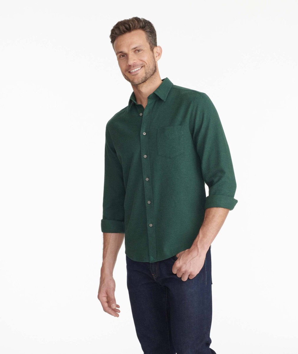 A man wearing a green flannel shirt