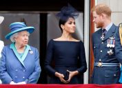 Queen Elizabeth, Meghan Markle, and Prince Harry on the balcony of Buckingham Palace for a Royal Air Force flypast in July 2018