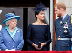 Queen Elizabeth, Meghan Markle, and Prince Harry on the balcony of Buckingham Palace for a Royal Air Force flypast in July 2018