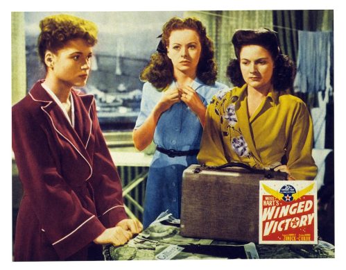 Judy Holliday, Jeanne Crain, and Jo-Carroll Dennison in a "Winged Victory" lobbycard from 1944