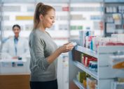 woman choosing otc meds at drugstore