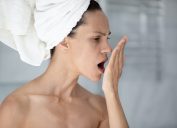 Woman checking her breath after shower