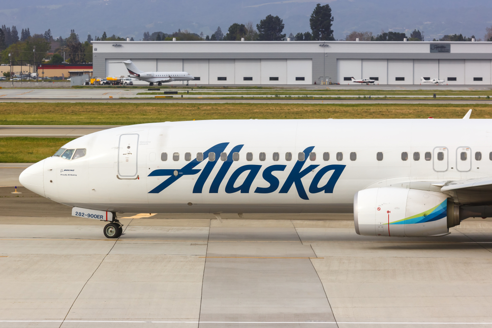An Alaska Airlines plane sitting on the runway