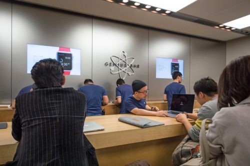TOKYO, JAPAN - CIRCA MARCH, 2017: Customers at Genius bar inside Apple Store. Apple Inc. is an American multinational technology company headquartered in Cupertino, California.