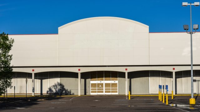 The exterior of a closed big box store