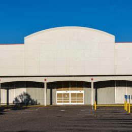 The exterior of a closed big box store