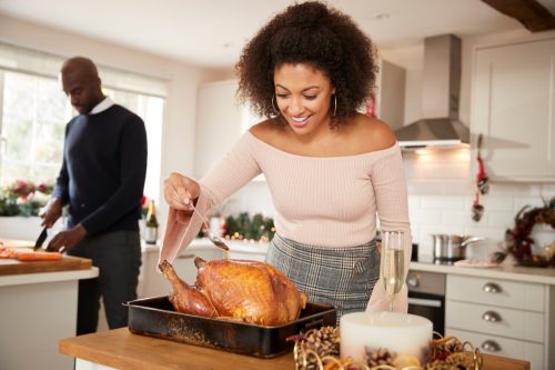 couple preparing Christmas dinner together at home