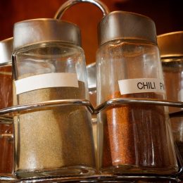 rotating metal rack full of spices