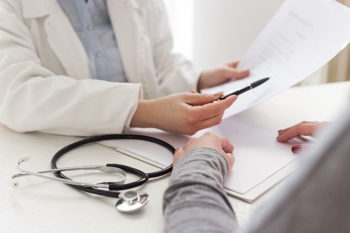 Closeup shot of female doctor writing prescription