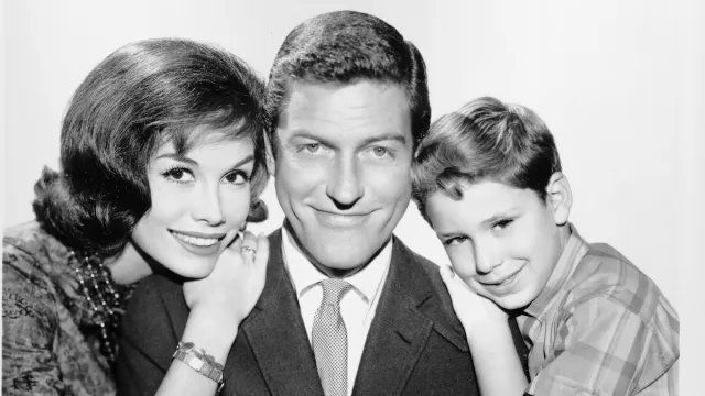 Mary Tyler Moore, Dick Van Dyke, and Larry Mathews in a black and white photo