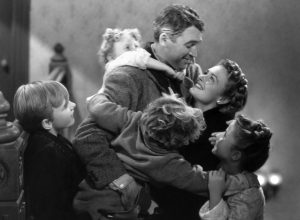 James Stewart, Donna Reed, Carol Coombs, Jimmy Hawkins, Larry Simms, and Karolyn Grimes in "It's a Wonderful Life"