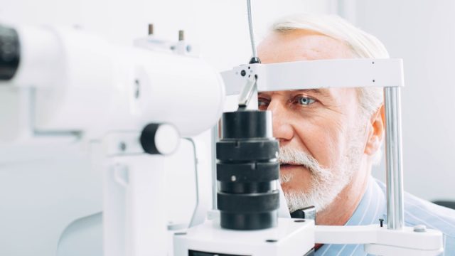 Senior,Patient,Checking,Vision,With,Special,Eye,Equipment