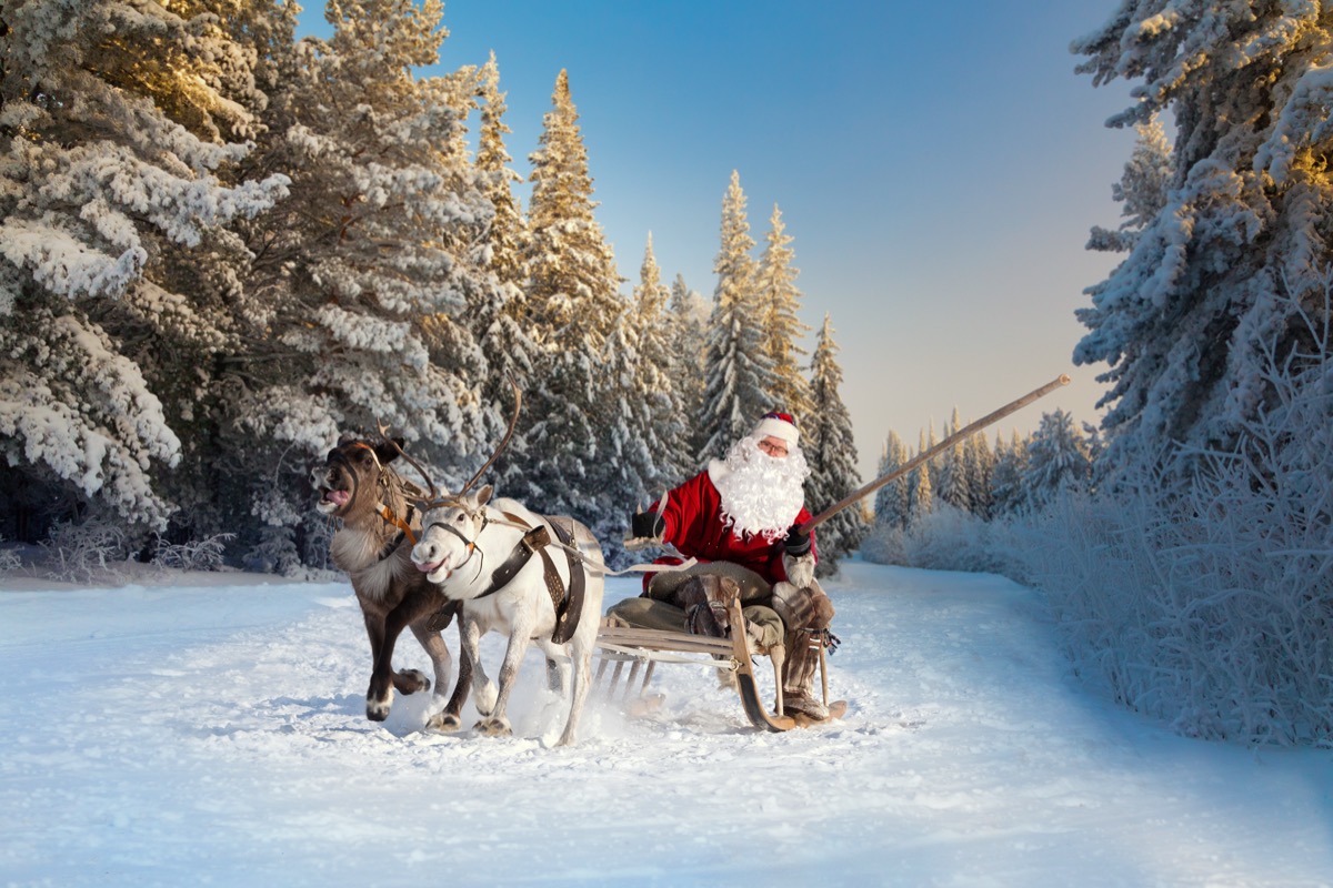Santa with reindeer in snow