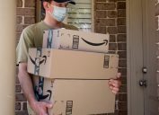 Amazon prime boxes and delivered to a front door of residential building during the COVID-19 pandemic.