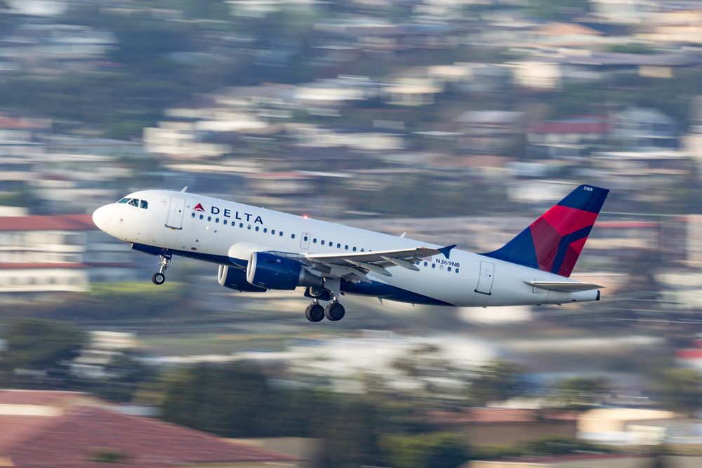 A Delta Air Lines flight taking off from an airport